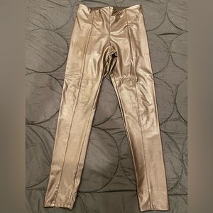 Brown vegan leather pants .